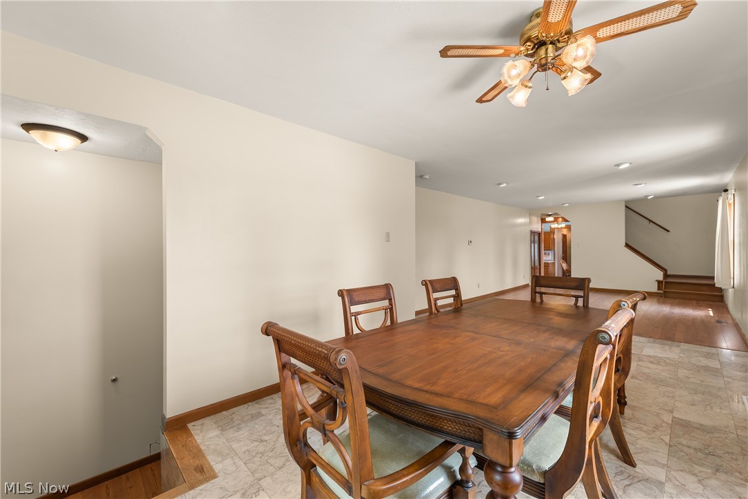 9990 Broadview Road Broadview Heights, OH 44147 - Photo 14 of 47 Dining area featuring a ceiling fan, light marble finish floors, stairs, and recessed lighting