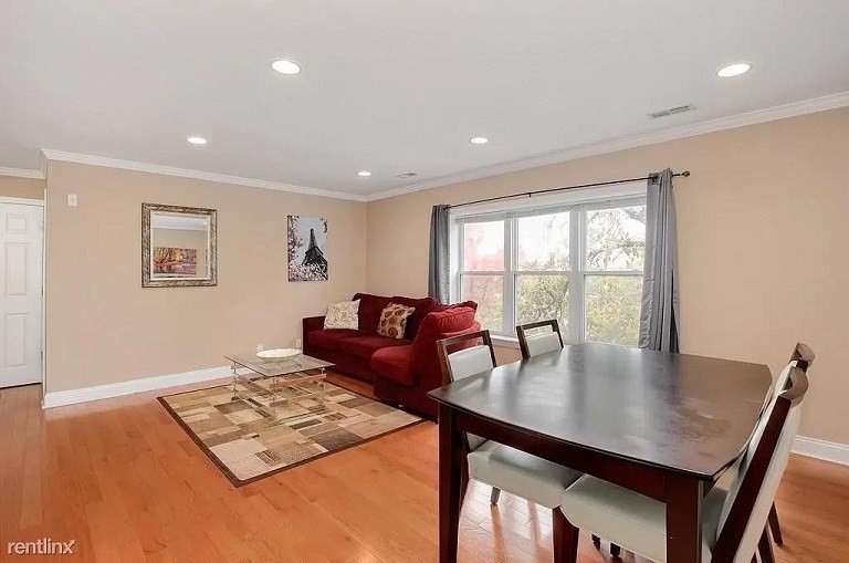 152 Newton Street, Unit 4 Boston, MA 02135 - Photo 3 of 11 a view of a dining room with furniture and a window