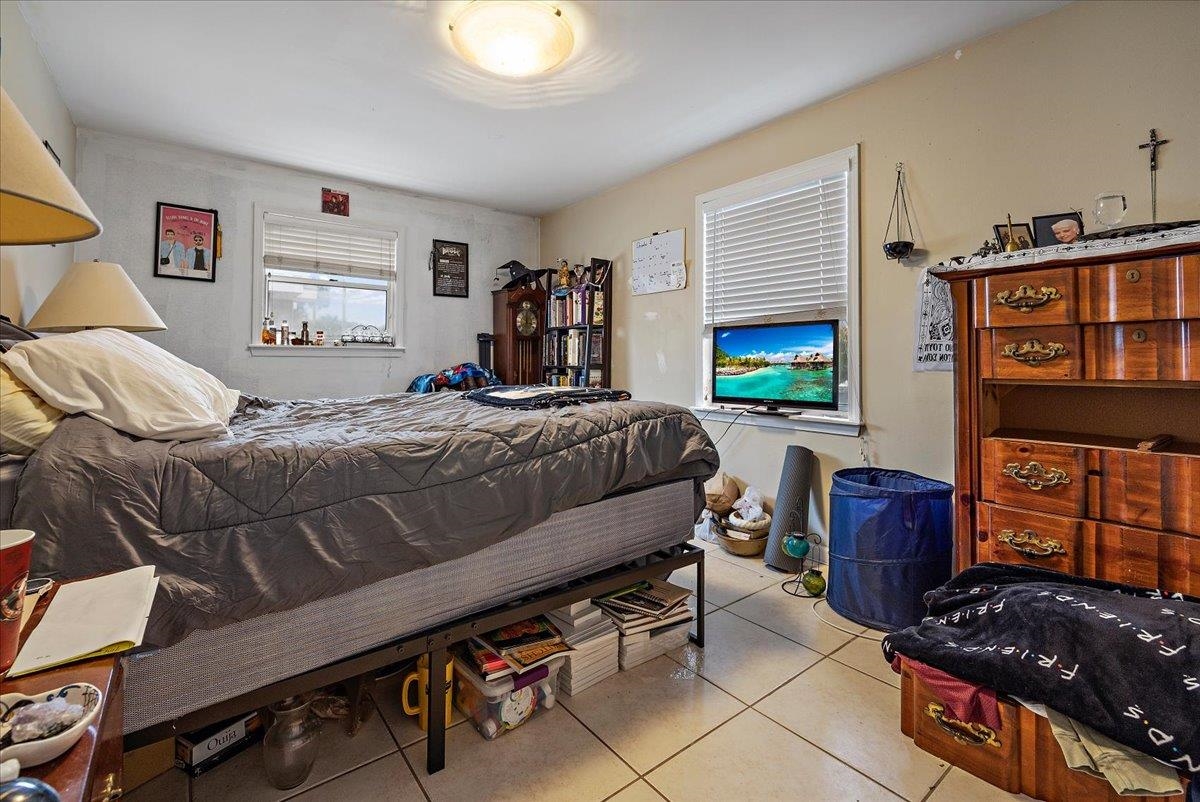 111 A Street St. Augustine Beach, FL 32080 - Photo 13 of 17 a bedroom with a bed and a window