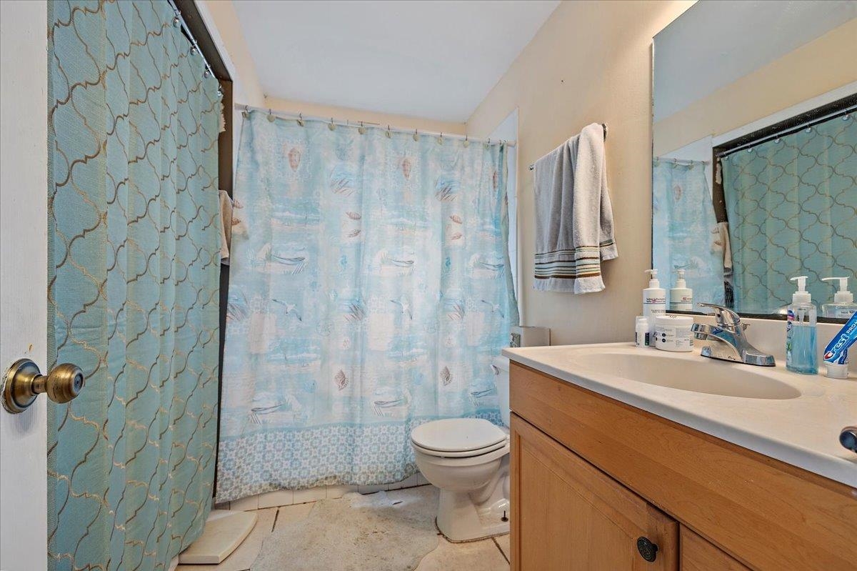 111 A Street St. Augustine Beach, FL 32080 - Photo 14 of 17 a bathroom with a sink a toilet and shower
