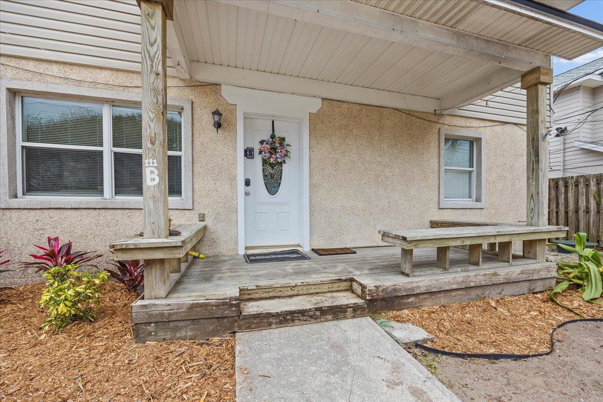 111 A Street St. Augustine Beach, FL 32080 - Photo 2 of 17 a front view of a house with outdoor seating