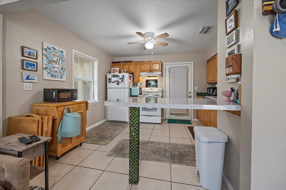 111 A Street St. Augustine Beach, FL 32080 - Photo 6 of 17 a living room with furniture and a chandelier