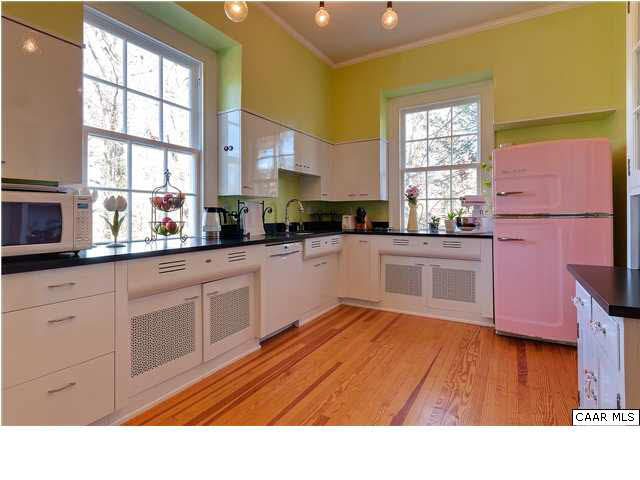 1325 Rugby Road Charlottesville, VA 22903 - Photo 13 of 29 The inviting kitchen features hardwood floors, breakfast room, butler's pantry with large second sink, refinished cabinets, 6 burner Ilve gas stove, granite counters, Bosch dishwasher, Big Chill refrigerator.