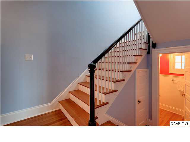 1325 Rugby Road Charlottesville, VA 22903 - Photo 16 of 29 Staircase to second level. Turned handrail - Powder room to right