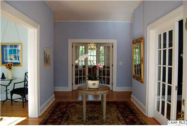 1325 Rugby Road Charlottesville, VA 22903 - Photo 7 of 29 Center hall entry. Music room on right, formal living room on left, formal dining ahead. Note the restored french doors leading to the music room and dining room.