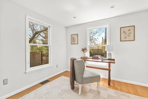 a workspace with furniture and window