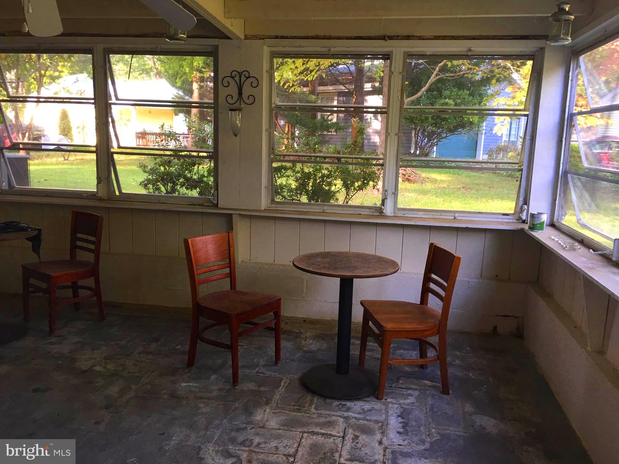 1501 Dogwood Road St. Leonard, MD 20685 - Photo 22 of 27 Enclosed Sunroom - great for a crab feast!