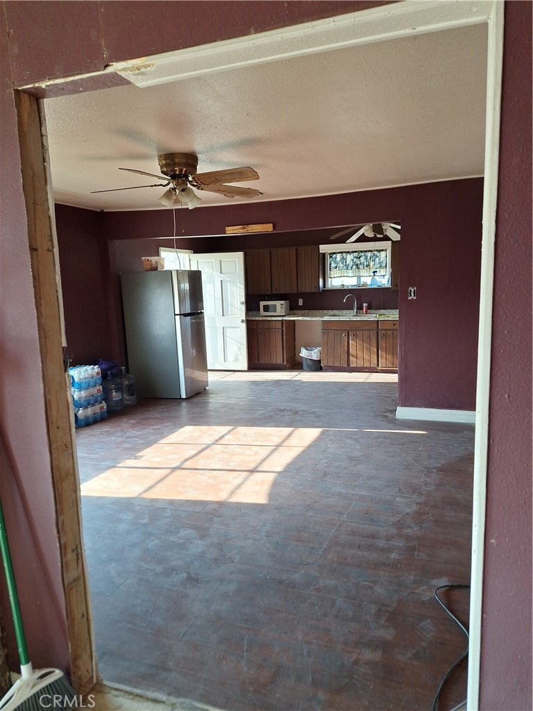 2352 Jacks Ranch Road Ridgecrest, CA 93555 - Photo 18 of 33 a view of an empty room with a kitchen