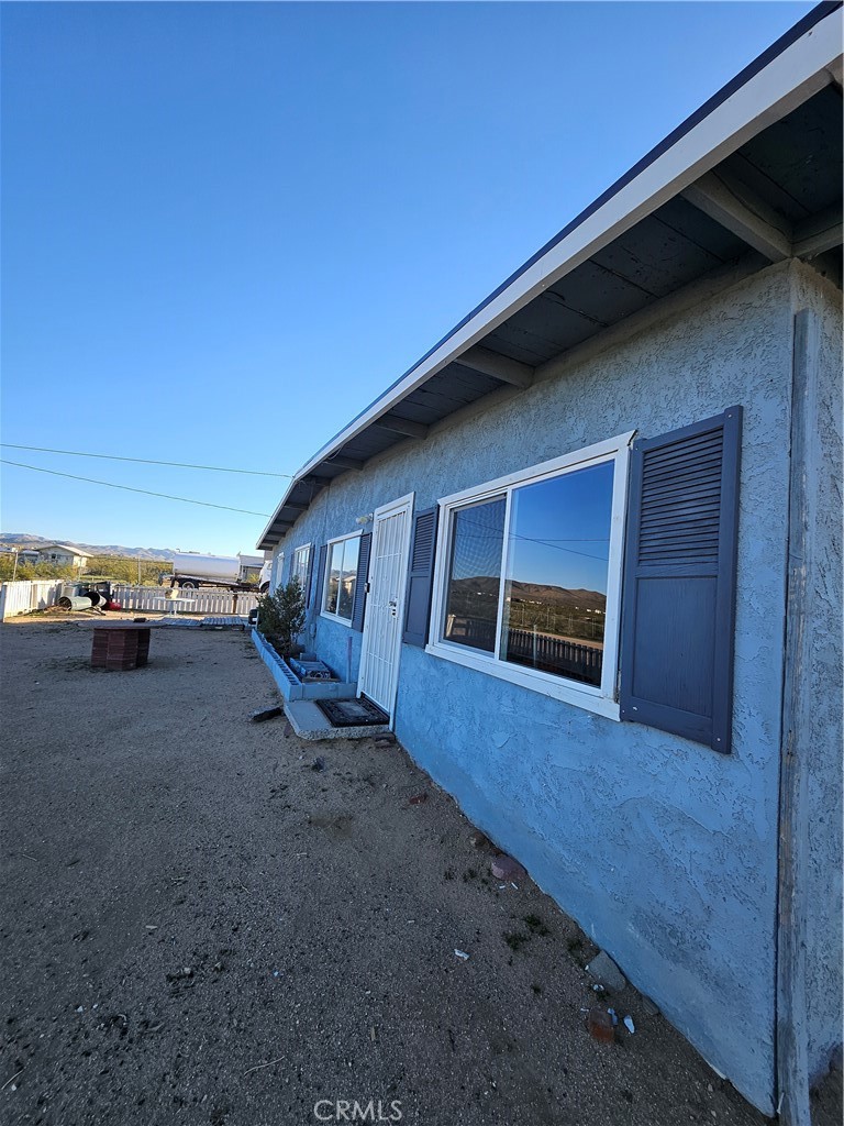 2352 Jacks Ranch Road Ridgecrest, CA 93555 - Photo 2 of 33 a view of a house with a yard
