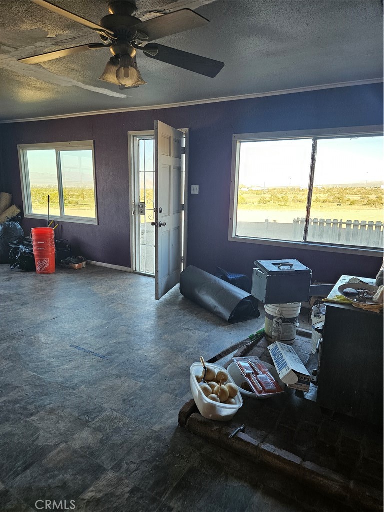 2352 Jacks Ranch Road Ridgecrest, CA 93555 - Photo 24 of 33 a living room with furniture and a large window