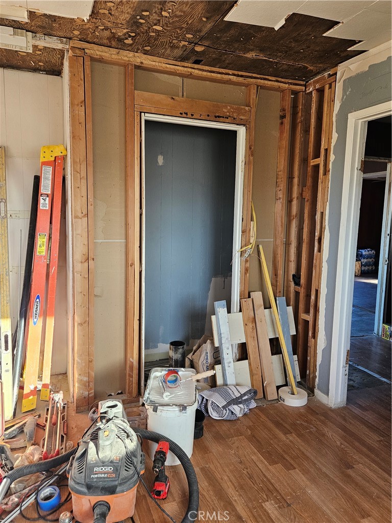 2352 Jacks Ranch Road Ridgecrest, CA 93555 - Photo 31 of 33 a view of a bedroom with wooden floor and a window