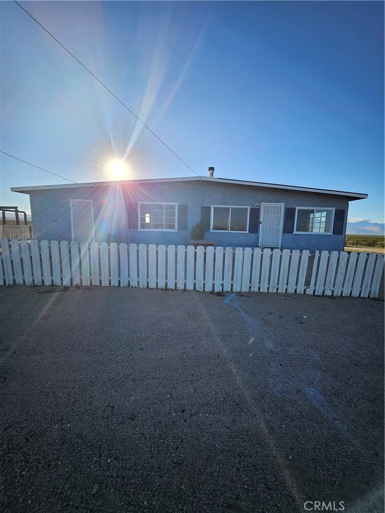 2352 Jacks Ranch Road Ridgecrest, CA 93555 - Photo 6 of 33 a view of a porch with wooden floor