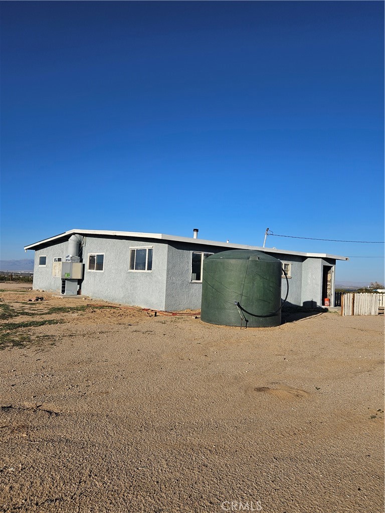 2352 Jacks Ranch Road Ridgecrest, CA 93555 - Photo 7 of 33 a front view of a house with a yard