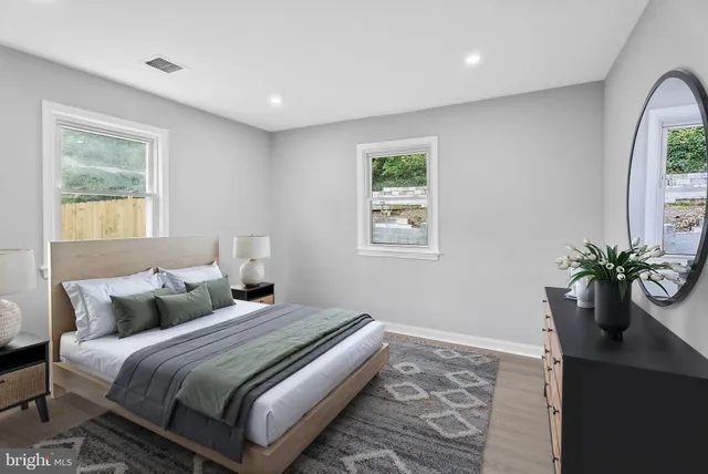 a bedroom with bed and a window