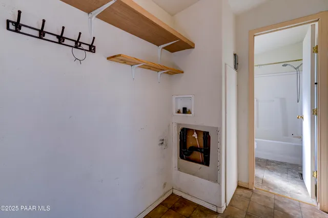 a room with white door and wooden door