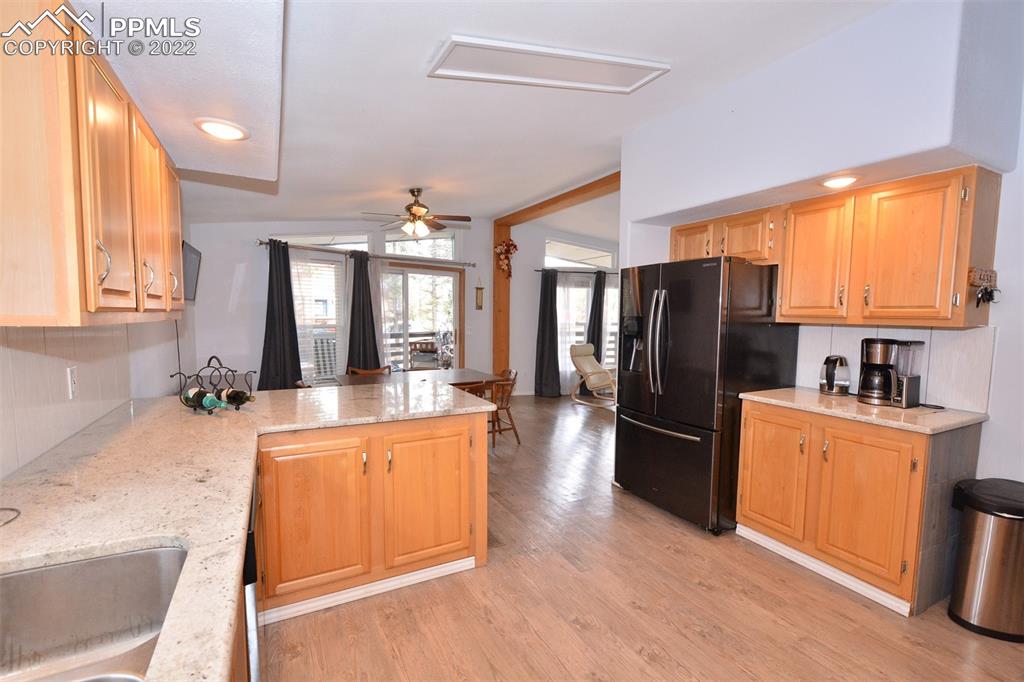 123 Pawutsy Road Florissant, CO 80816 - Photo 12 of 30 a large kitchen with a lot of counter space and stainless steel appliances