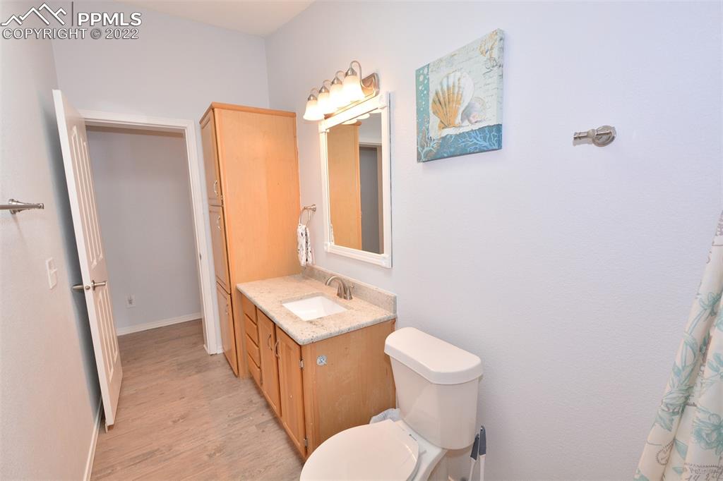 123 Pawutsy Road Florissant, CO 80816 - Photo 17 of 30 a bathroom with a toilet sink and mirror