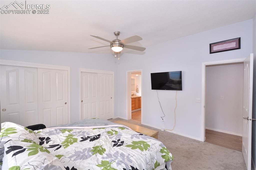 123 Pawutsy Road Florissant, CO 80816 - Photo 19 of 30 a bedroom with a bed and a flat screen tv