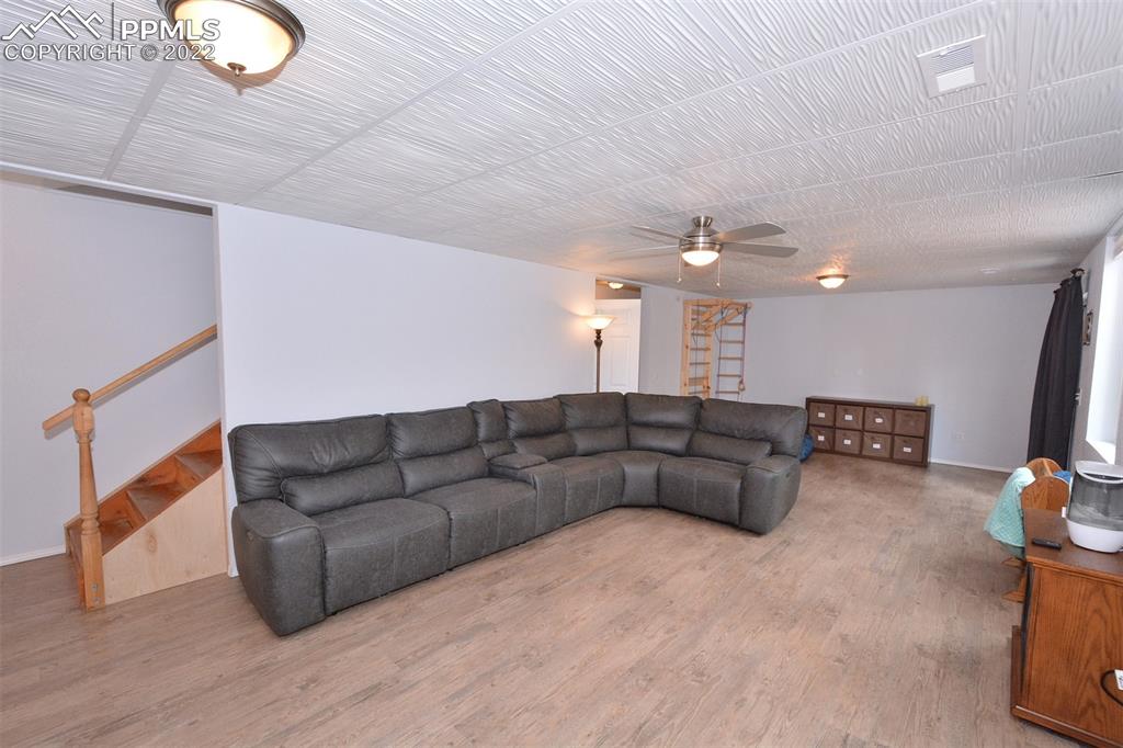 123 Pawutsy Road Florissant, CO 80816 - Photo 28 of 30 a living room with furniture and a flat screen tv