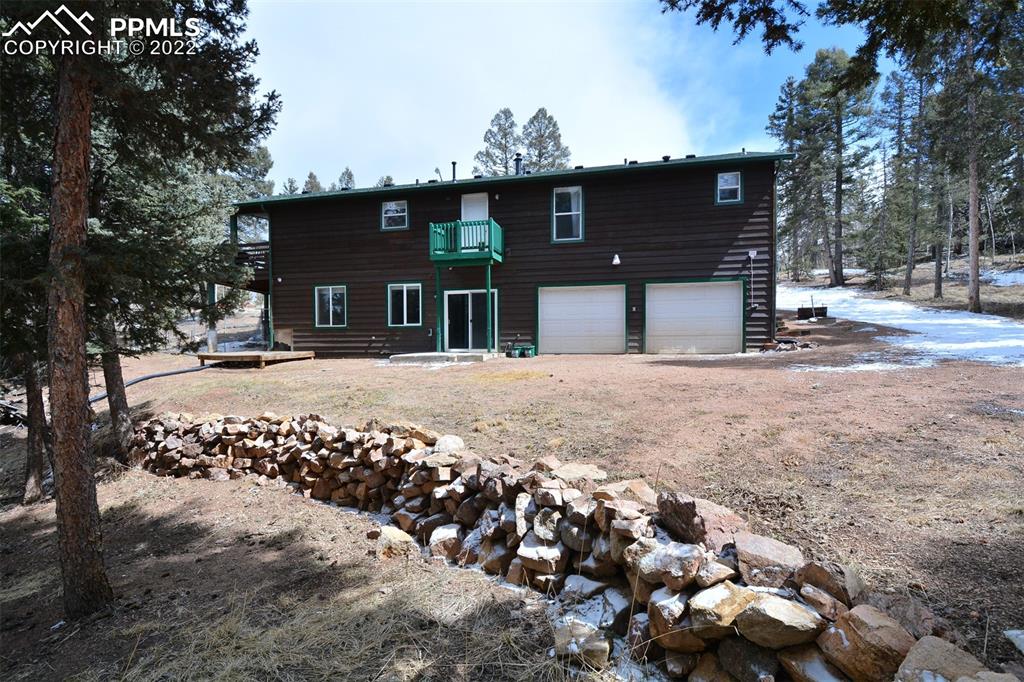 123 Pawutsy Road Florissant, CO 80816 - Photo 4 of 30 a view of a house with a snow on the road