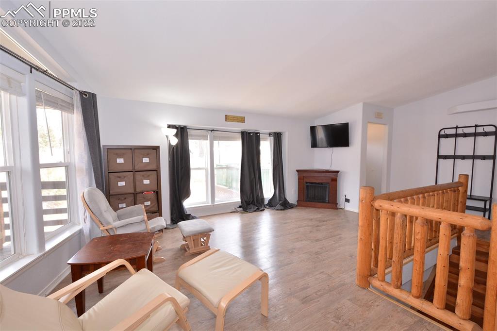 123 Pawutsy Road Florissant, CO 80816 - Photo 7 of 30 a living room with fireplace furniture and a flat screen tv