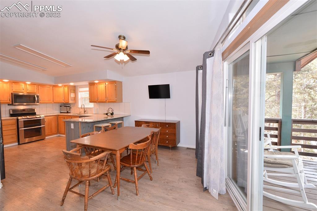 123 Pawutsy Road Florissant, CO 80816 - Photo 8 of 30 a view of a dining room with furniture window and wooden floor