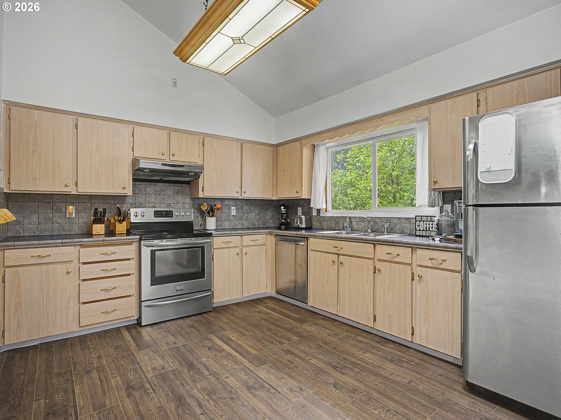18015 Davis Street Sandy, OR 97055 - Photo 14 of 40 a kitchen with granite countertop white cabinets and white appliances