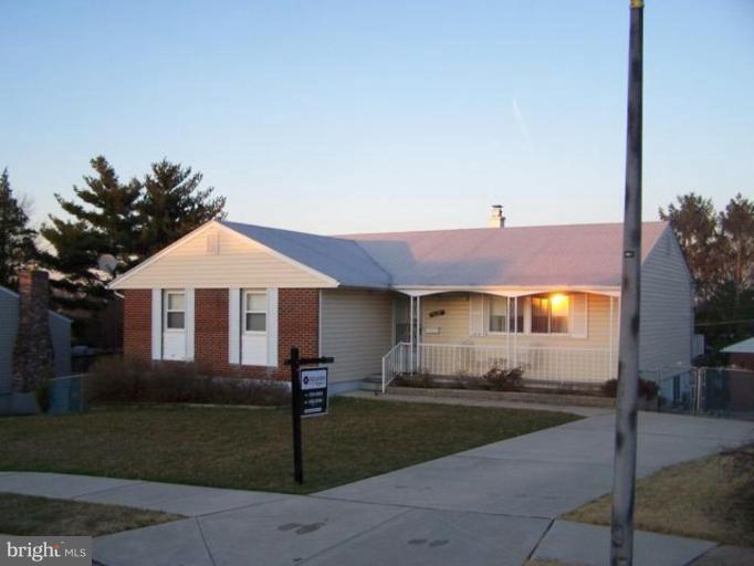 1519 Customs Road Rosedale, MD 21237 - Photo 1 of 1 a front view of a house with a yard