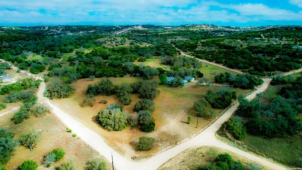 an aerial view of residential house with outdoor space