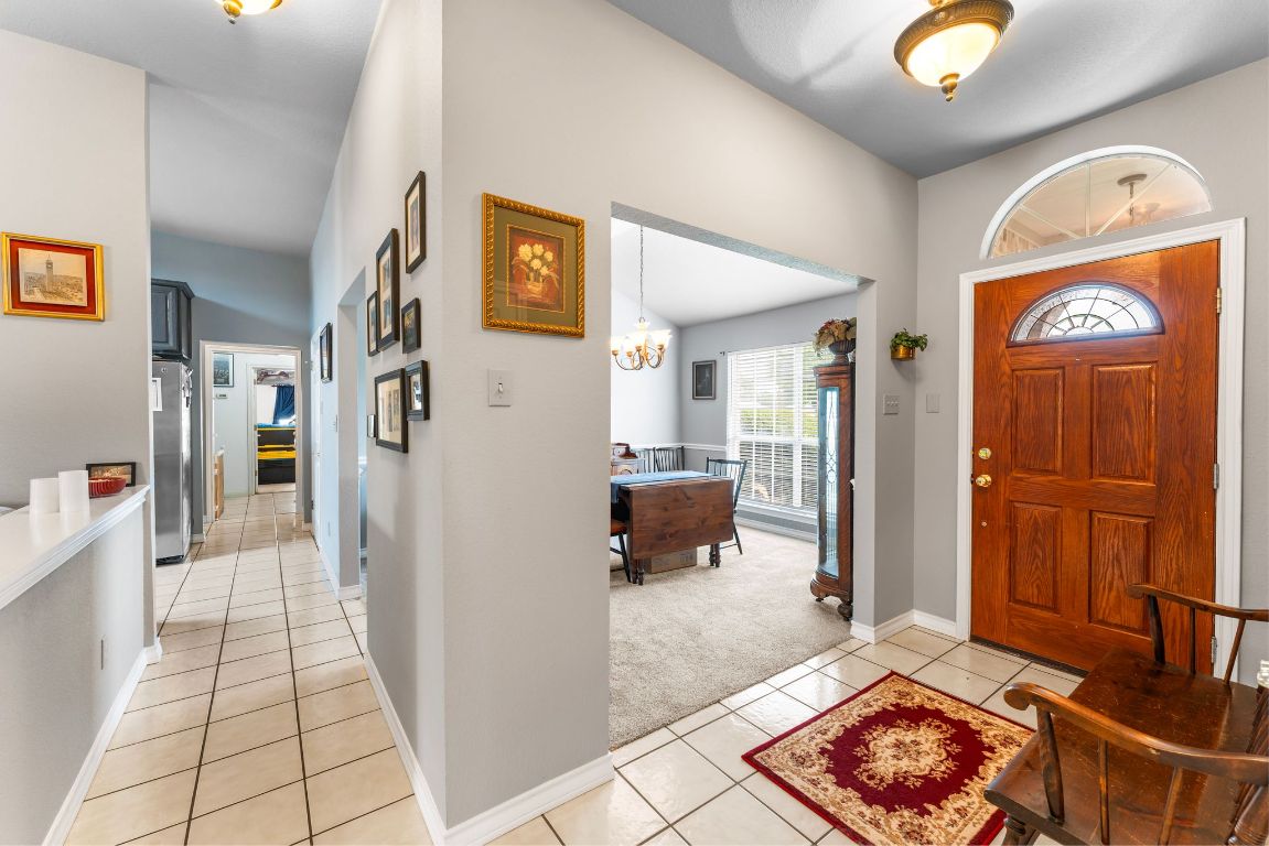221 Breakaway Road Cedar Park, TX 78613 - Photo 20 of 39 a view of a hallway to a livingroom with furniture and front door