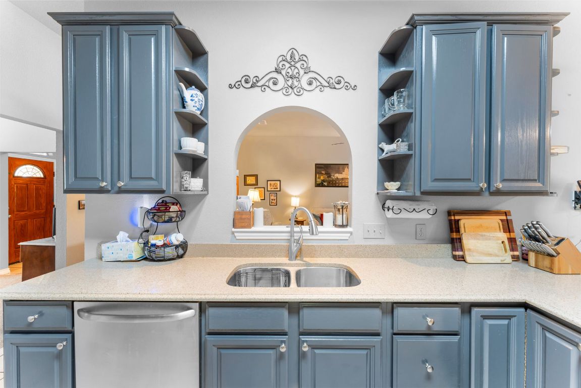 221 Breakaway Road Cedar Park, TX 78613 - Photo 26 of 39 a kitchen with a sink cabinets and a wooden floor