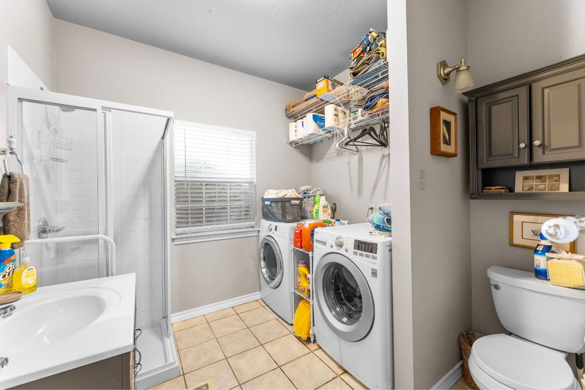 221 Breakaway Road Cedar Park, TX 78613 - Photo 38 of 39 a utility room with dryer and washer