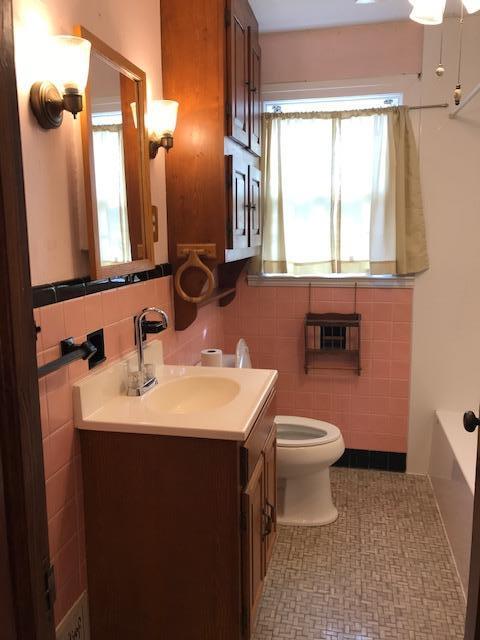 313 Turner Road Salem, VA 24153 - Photo 7 of 15 a bathroom with a toilet sink and mirror