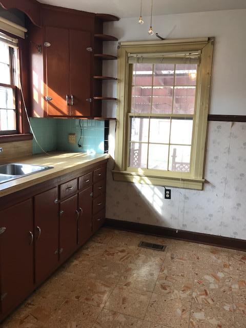 313 Turner Road Salem, VA 24153 - Photo 10 of 15 a view of a kitchen with a sink and dishwasher next to a window