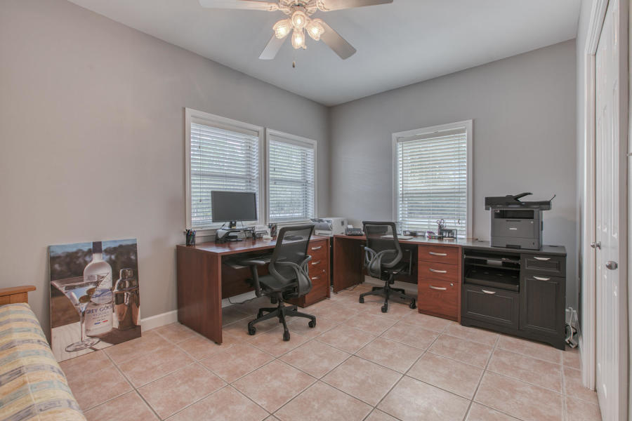 377 Ridge Road Santa Rosa Beach, FL 32459 - Photo 11 of 46 a view of a workspace with furniture and a window