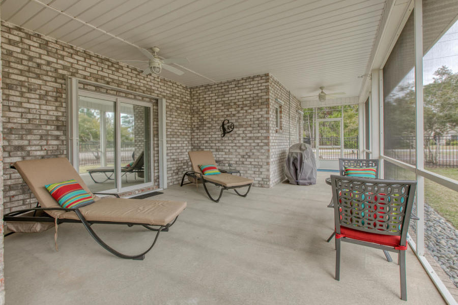 377 Ridge Road Santa Rosa Beach, FL 32459 - Photo 13 of 46 a living room with furniture and a floor to ceiling window
