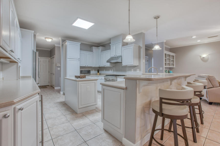 377 Ridge Road Santa Rosa Beach, FL 32459 - Photo 3 of 46 a kitchen with a sink a counter top space appliances and cabinets