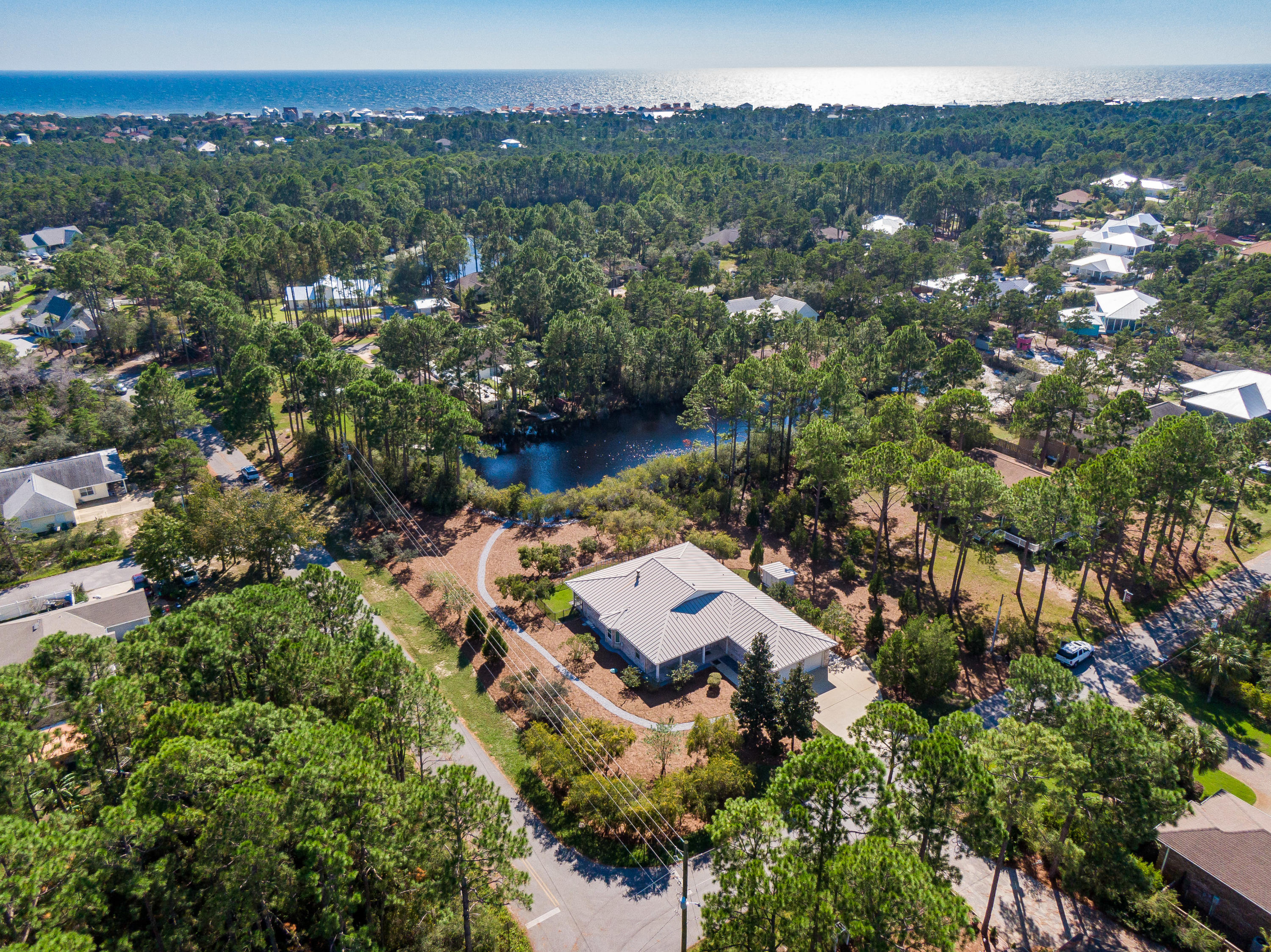 377 Ridge Road Santa Rosa Beach, FL 32459 - Photo 31 of 46 an aerial view of residential house with outdoor space and river