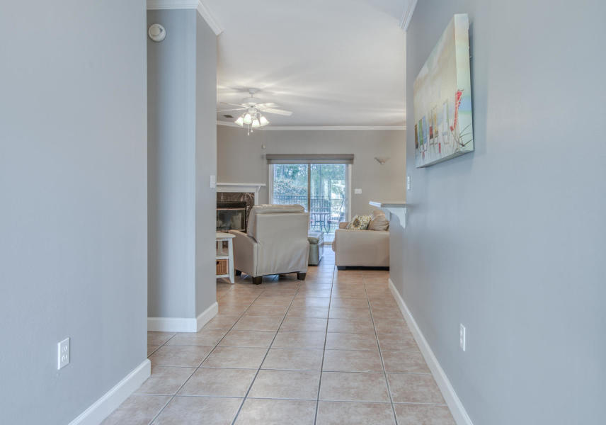 377 Ridge Road Santa Rosa Beach, FL 32459 - Photo 5 of 46 a view of a hallway with a livingroom and a couch