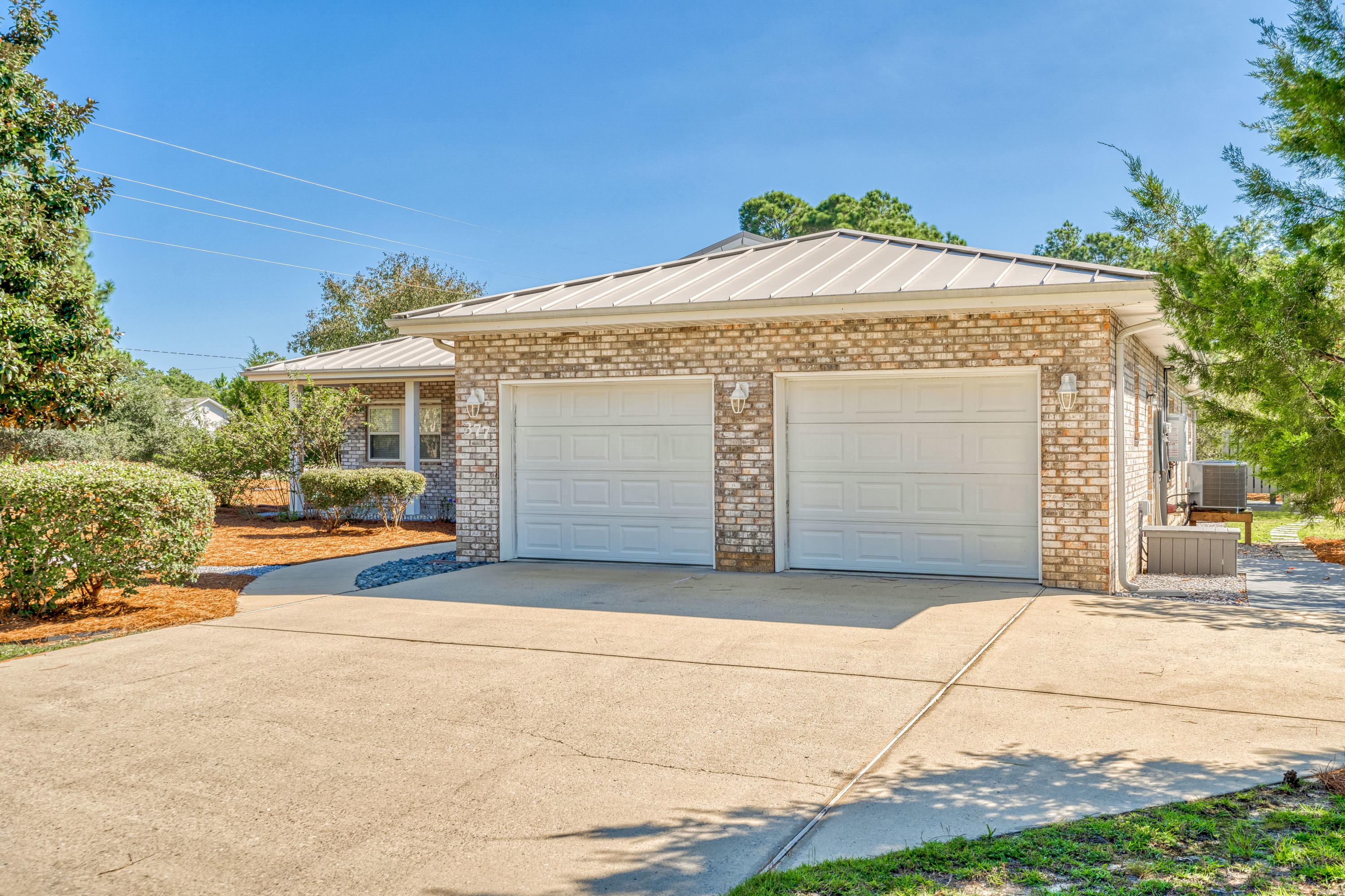 377 Ridge Road Santa Rosa Beach, FL 32459 - Photo 44 of 46 a front view of a house with a garage