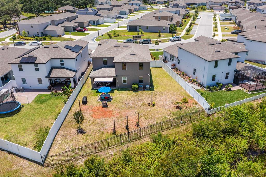 5637 Beggs Road St. Cloud, FL 34771 - Photo 33 of 35 an aerial view of a house with a swimming pool