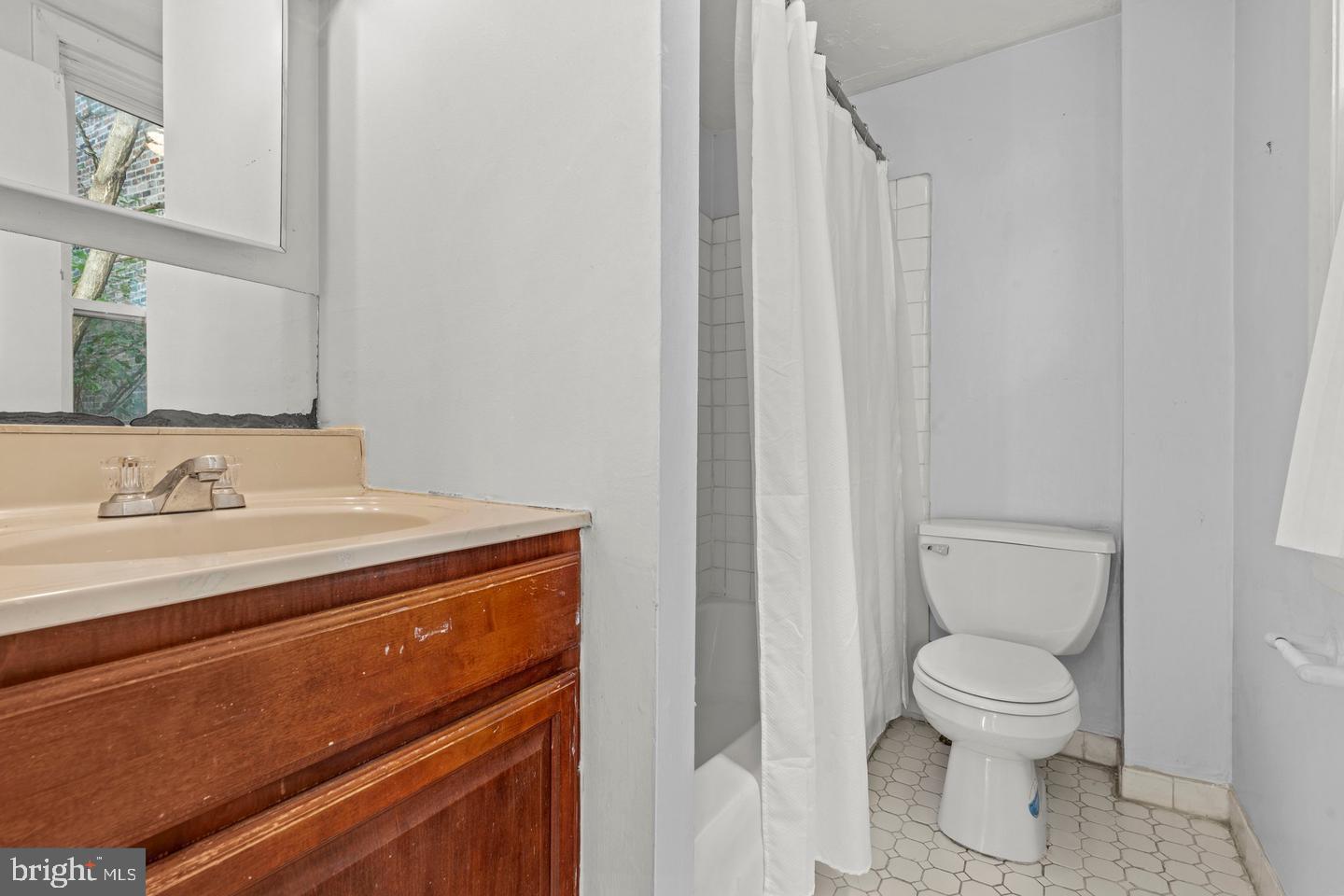 1314 Addison Street Philadelphia, PA 19147 - Photo 11 of 21 a bathroom with a sink a toilet and a mirror