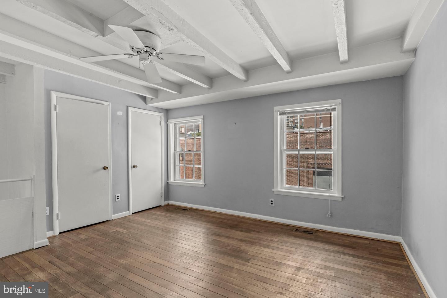 1314 Addison Street Philadelphia, PA 19147 - Photo 15 of 21 a view of an empty room with wooden floor and a window
