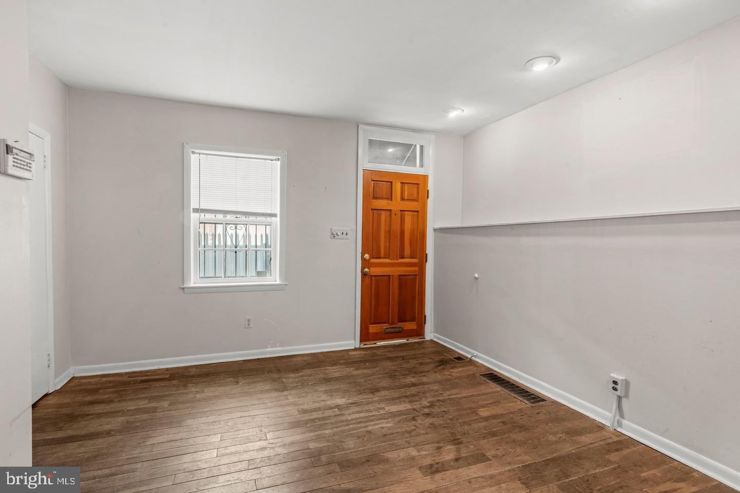 1314 Addison Street Philadelphia, PA 19147 - Photo 4 of 21 an empty room with wooden floor and windows