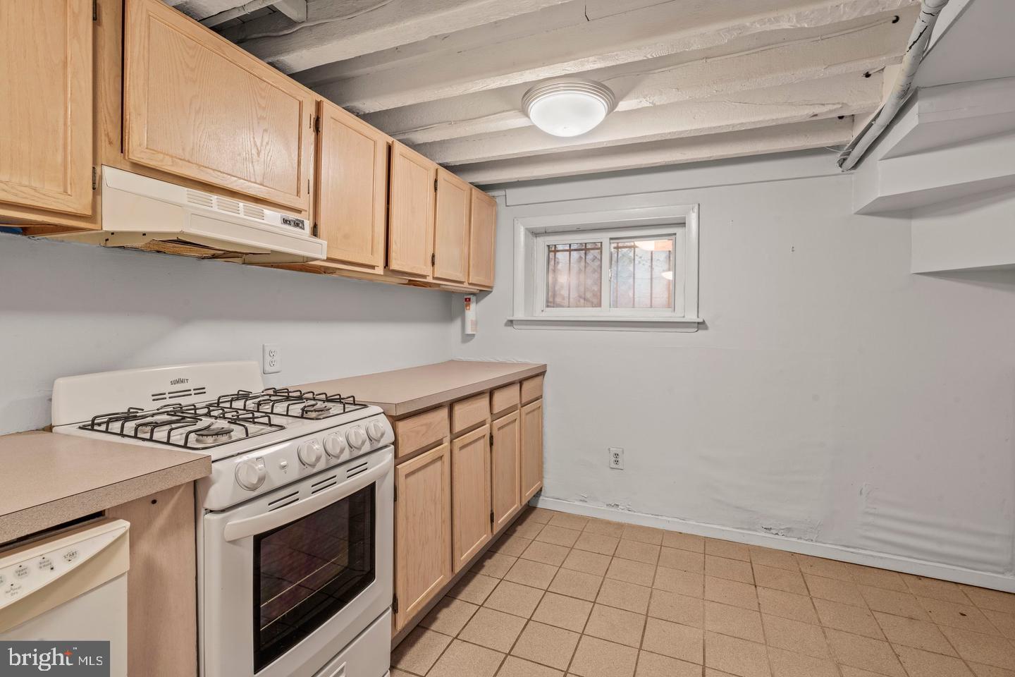 1314 Addison Street Philadelphia, PA 19147 - Photo 5 of 21 a kitchen with white cabinets and appliances