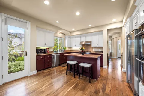 a living room with furniture a table and a large window