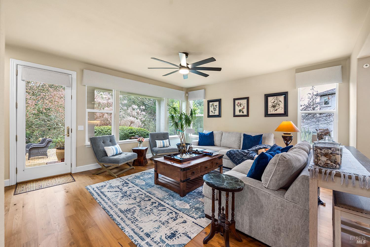 3696 Newbury Court Santa Rosa, CA 95404 - Photo 16 of 59 a living room with furniture a table and a large window