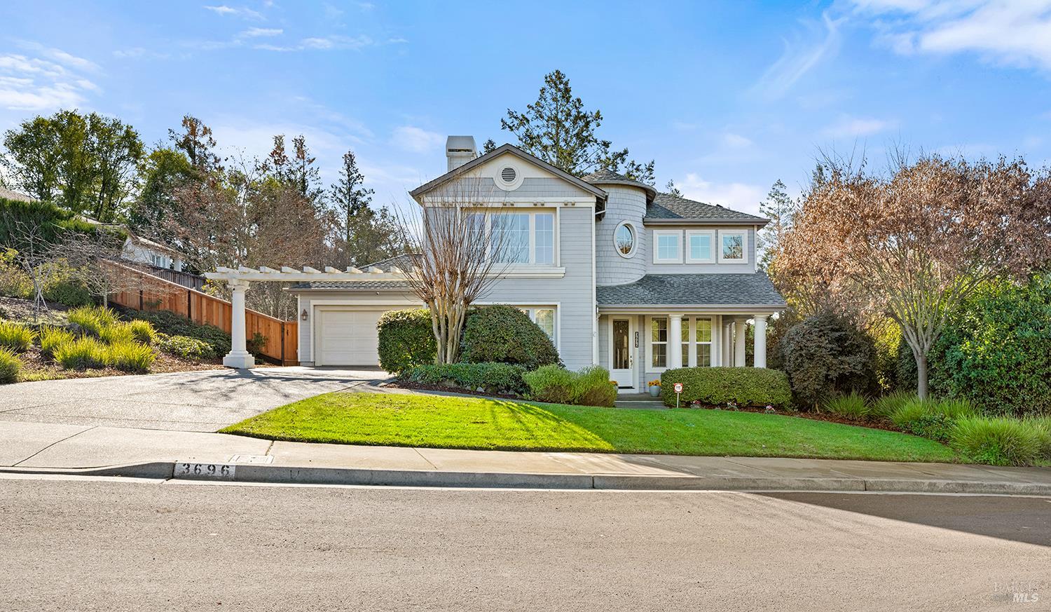 3696 Newbury Court Santa Rosa, CA 95404 - Photo 2 of 59 a front view of a house with a garden and trees