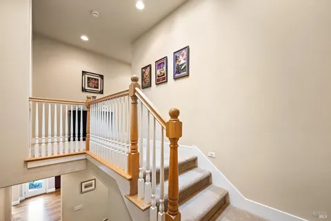 a view of a two chairs in the balcony