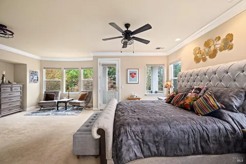 a view of a hallway with seating area